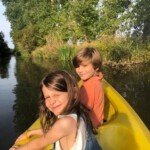 Canoes on the river at Le Petit Moulin